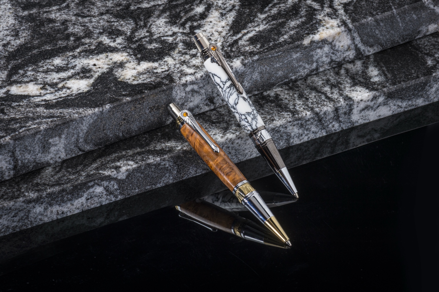 Art Deco pens in a diagonal composition with their reflections below